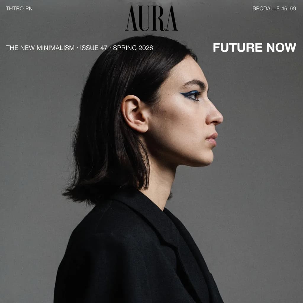 AURA editorial fashion magazine cover with monochrome profile portrait